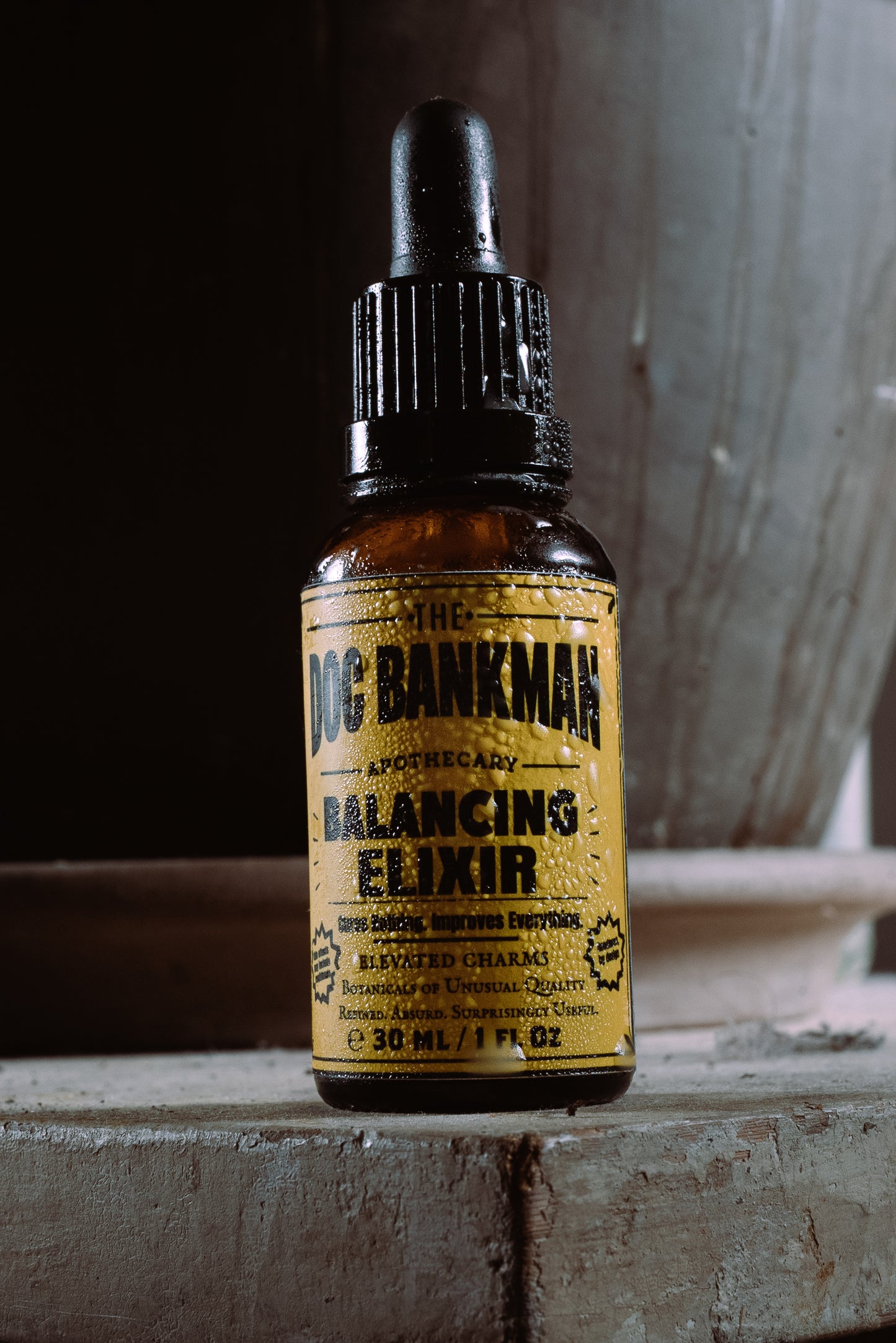 Bottle of Doc Bankman Balancing Elixir on a rustic surface