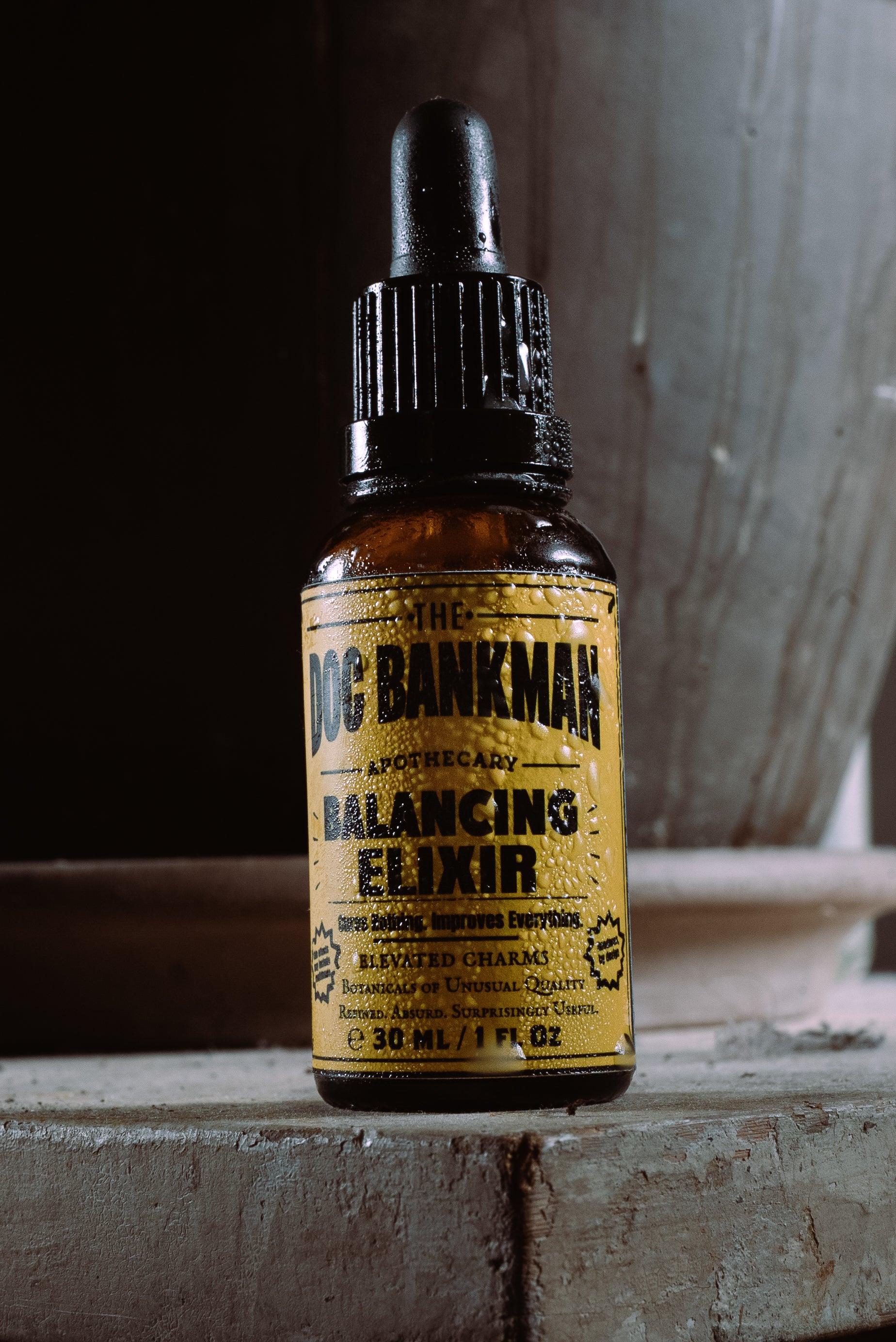 Bottle of Doc Bankman Balancing Elixir on a rustic surface